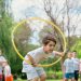 Kids enjoying a summer day playing with hula hoops in a park, showcasing friendship and fun.